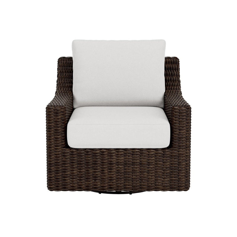 Wicker armchair with white cushions on a white background