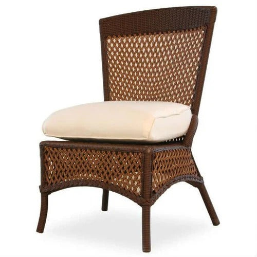 Wicker chair with beige cushion on a white background