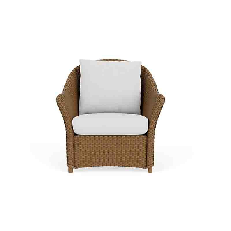 Wicker chair with white cushions on a white background