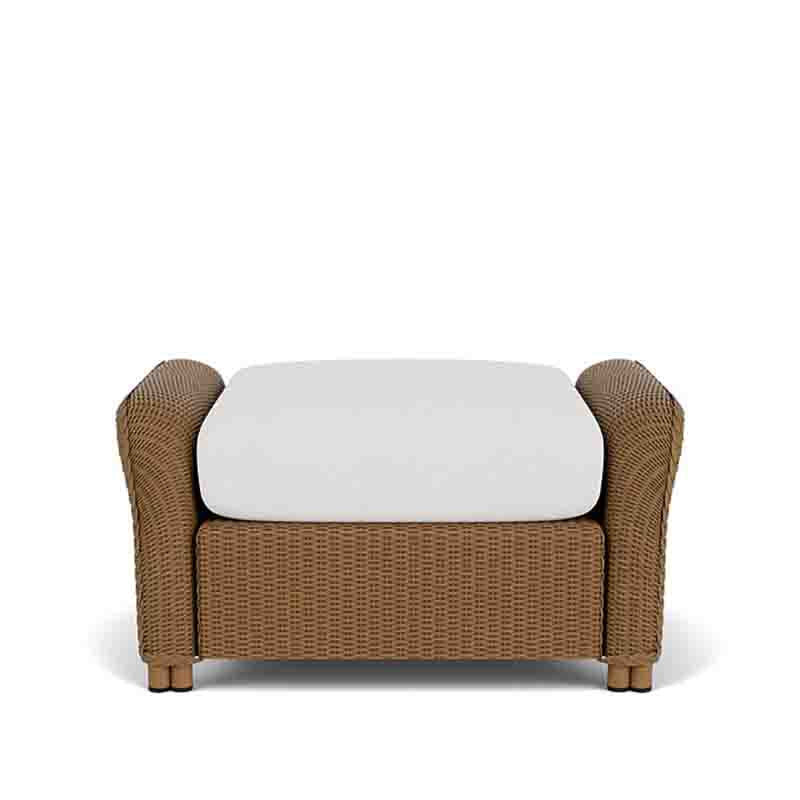 Wicker chair with a white cushion on a white background