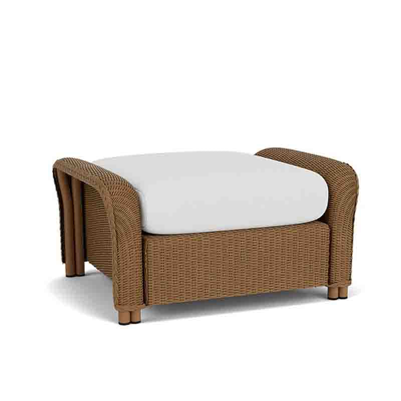 Brown wicker chair with a white cushion on a white background