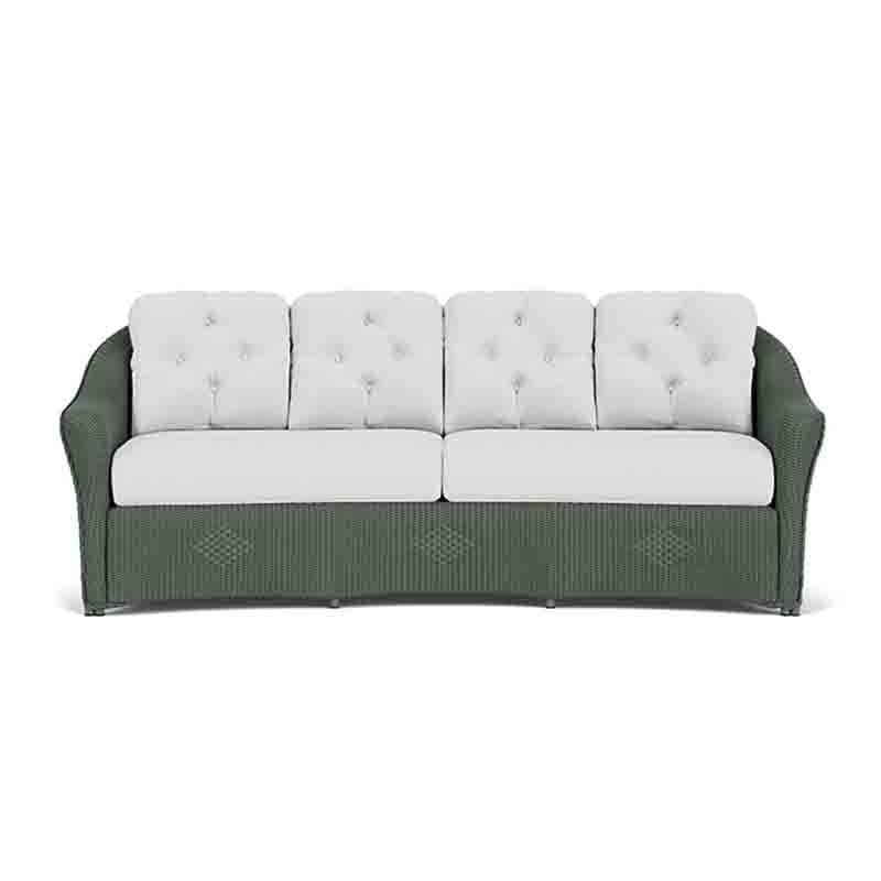 Sofa with green frame and white cushions on a white background