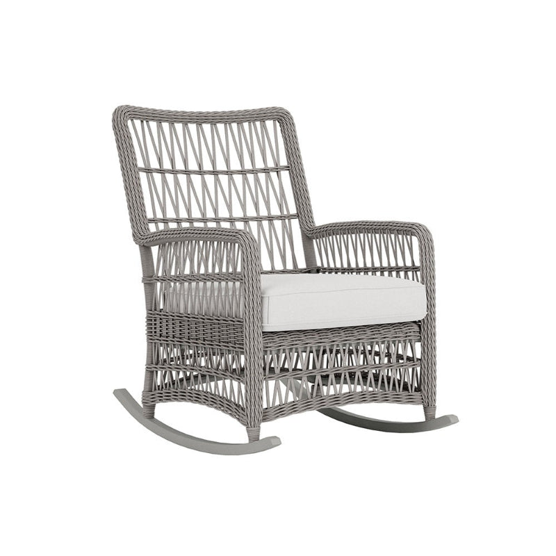Gray wicker rocking chair with a white cushion on a white background