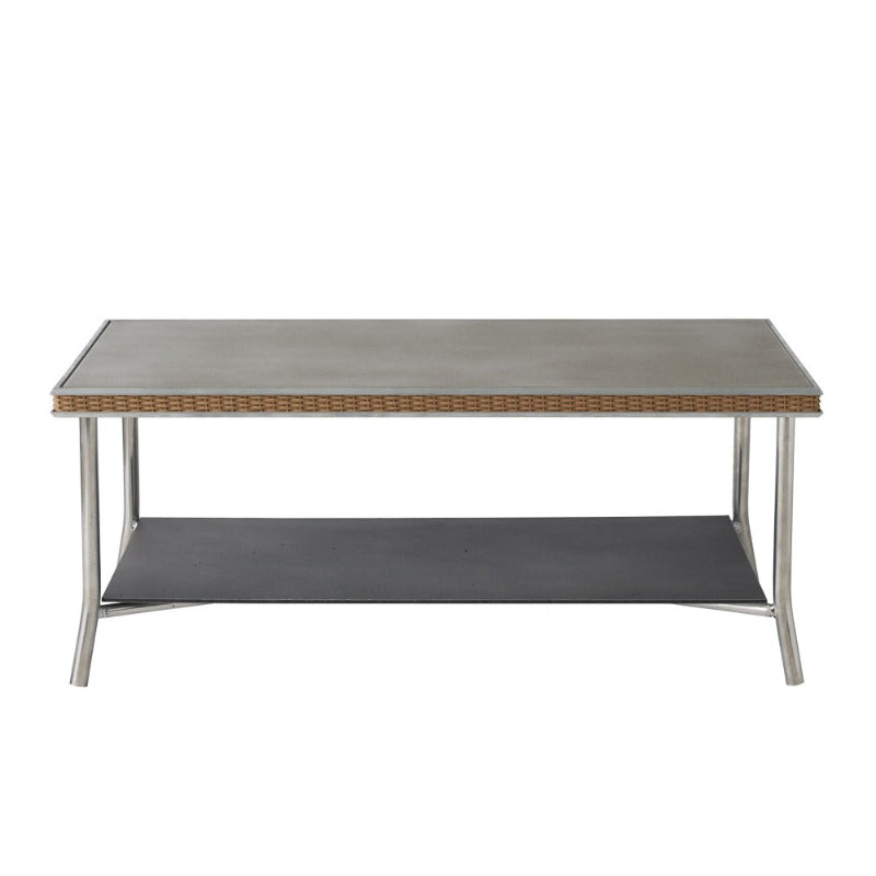 Coffee table with woven top and metal frame on a white background