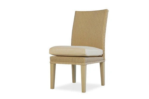 Beige wicker chair with a cushion on a white background
