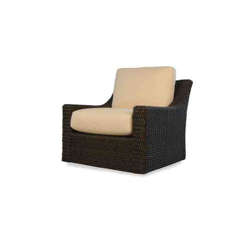 Wicker chair with beige cushions on a white background
