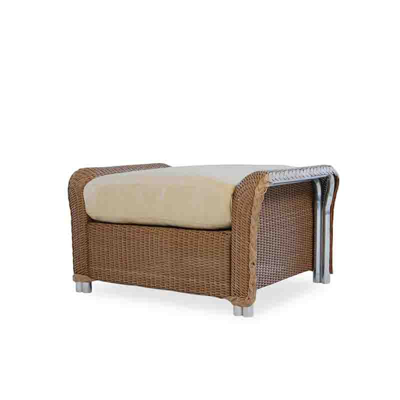 Wicker chair with beige cushion on a white background