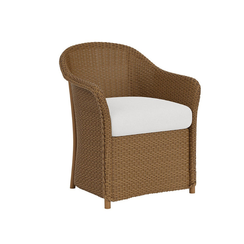 Brown wicker chair with a white cushion on a white background
