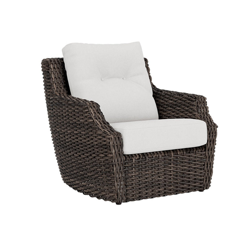 Wicker armchair with white cushion on a white background