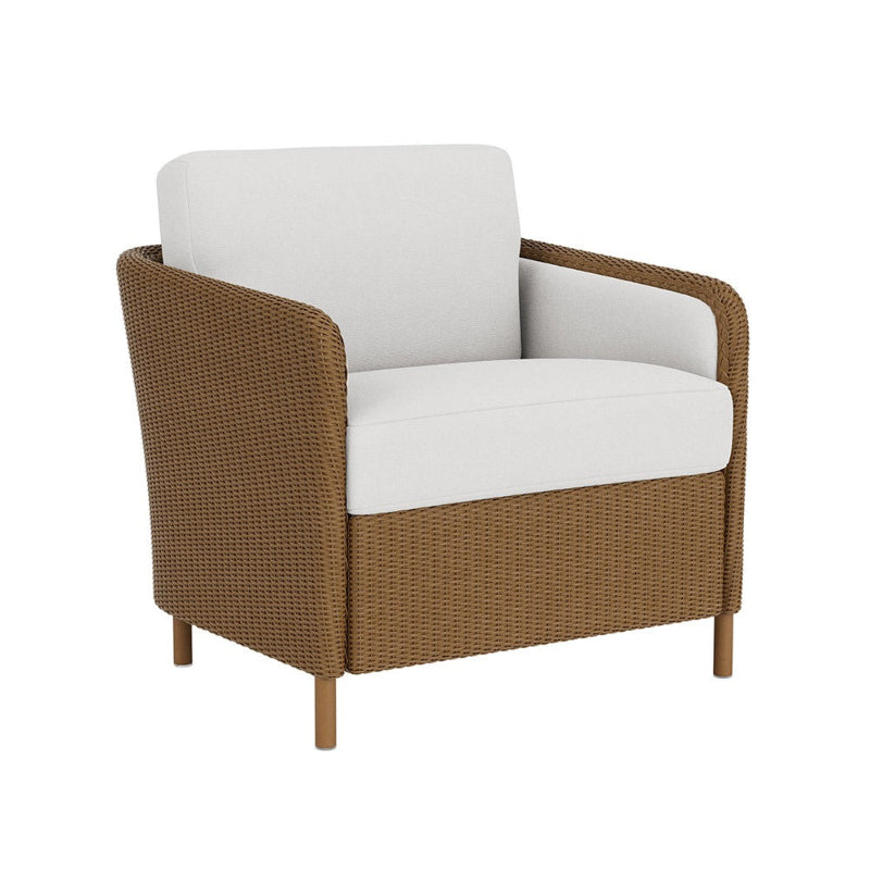 Brown wicker armchair with white cushions on a white background