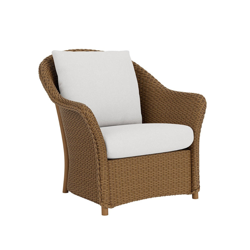Brown wicker chair with white cushions on a white background