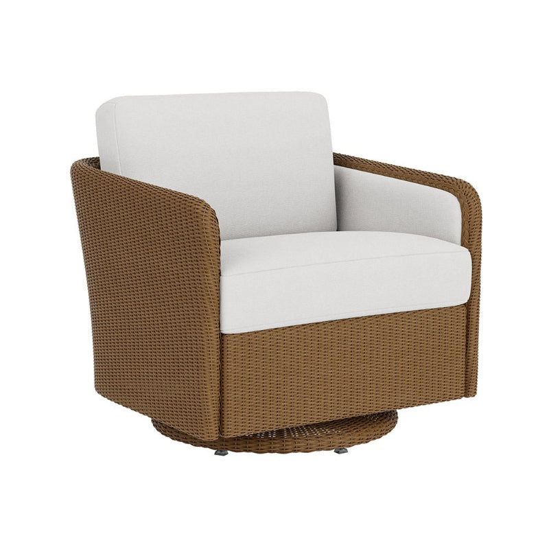 Brown wicker armchair with white cushions on a white background