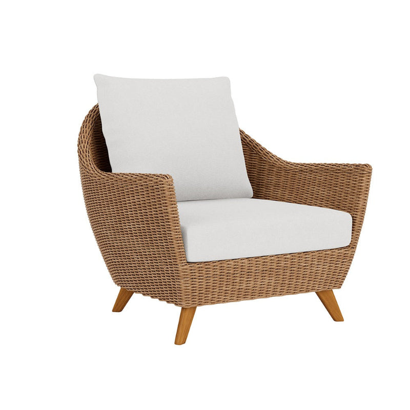 Wicker armchair with white cushions on a white background