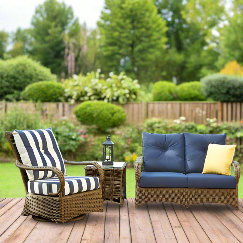 Outdoor furniture set with wicker chairs and table on a wooden deck