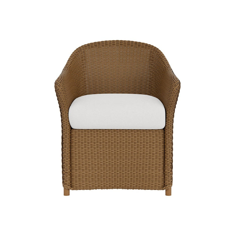 Brown wicker chair with a white cushion on a white background