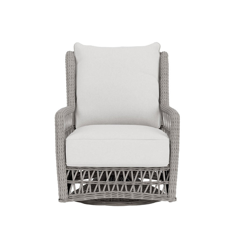 Wicker chair with white cushion on a white background