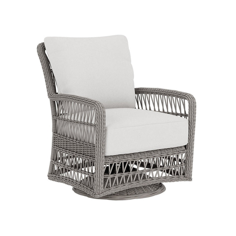 Wicker chair with white cushions on a white background