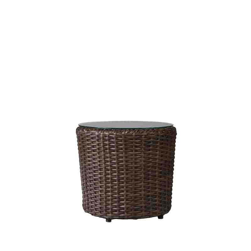 Wicker side table with glass top on a white background