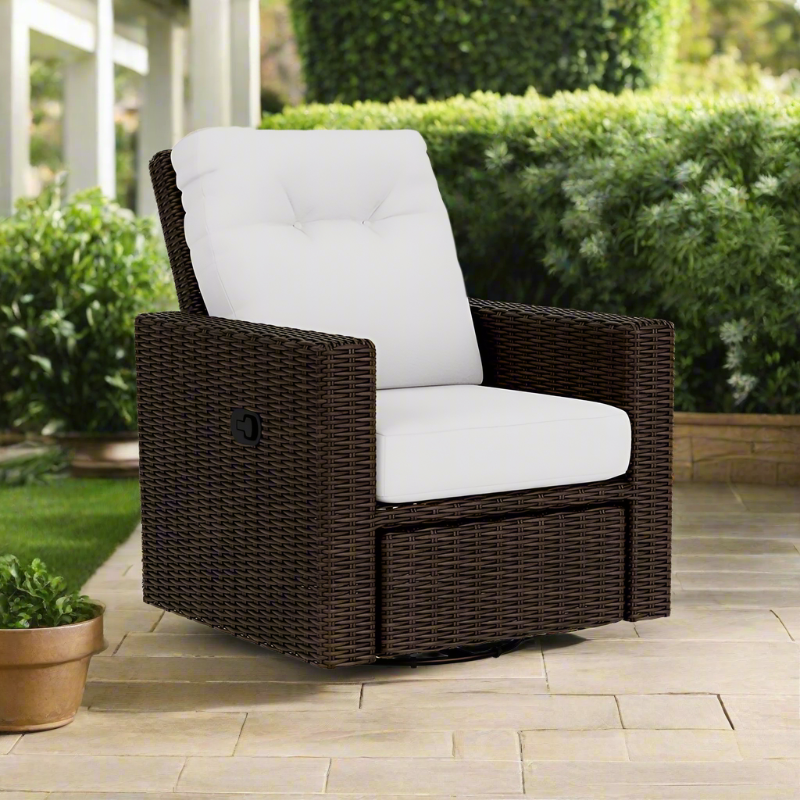 Brown wicker chair with white cushion on a patio