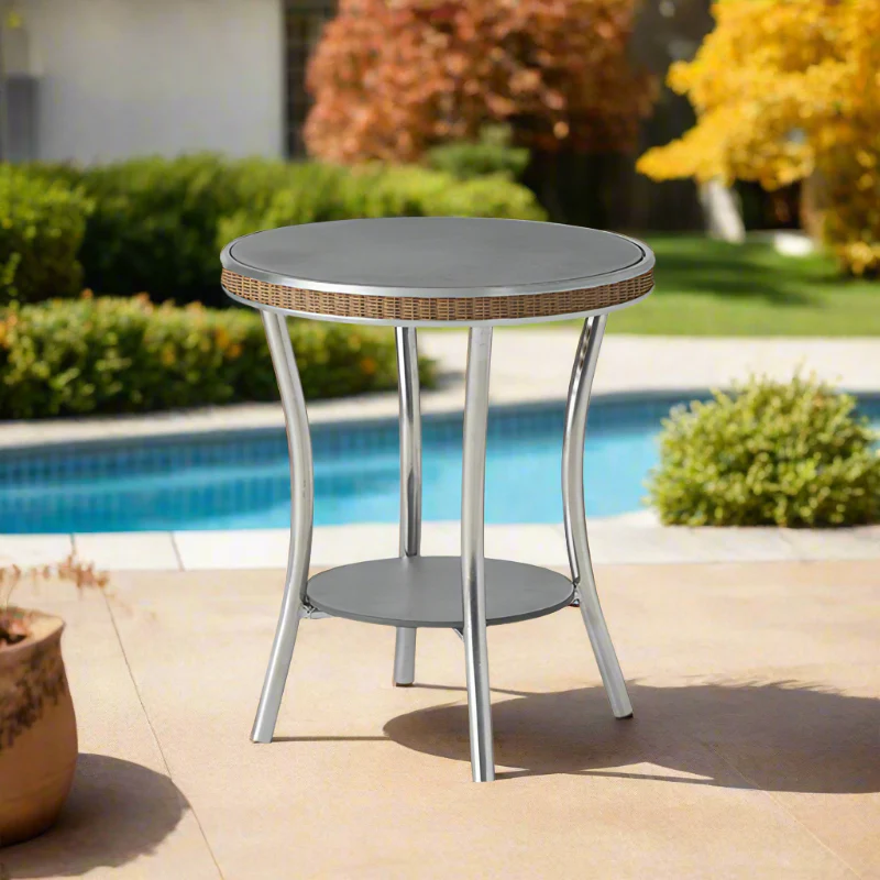 Round outdoor table with wicker top by a poolside