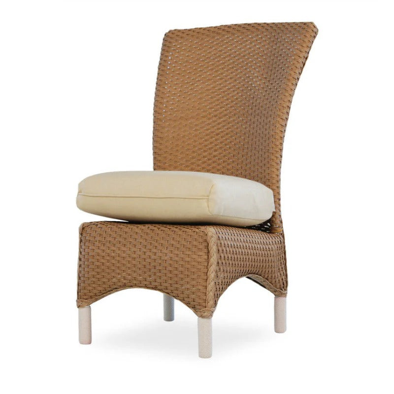 Wicker chair with a beige cushion on a white background