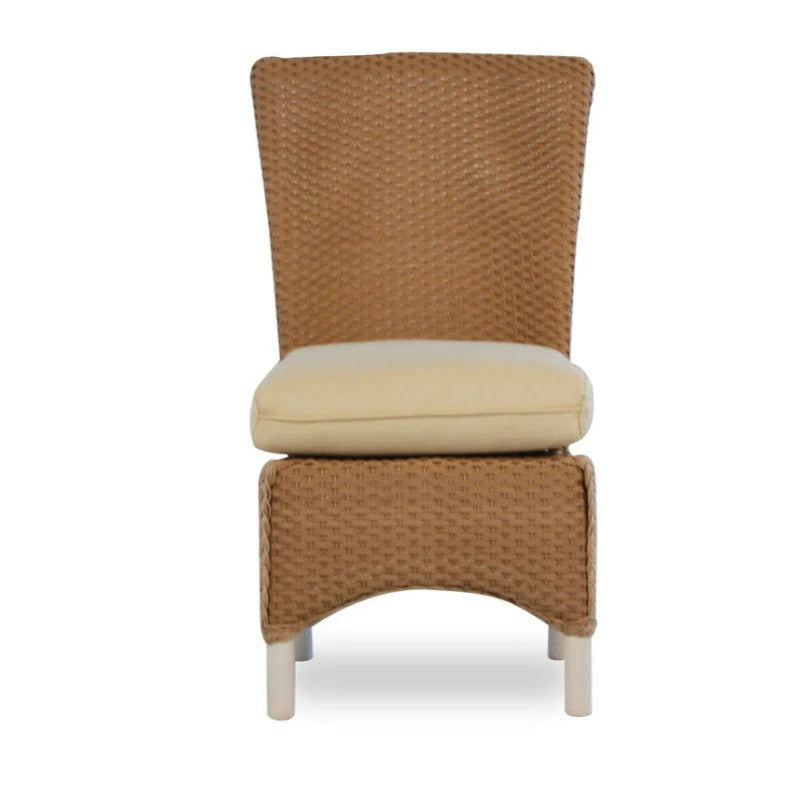Wicker chair with beige cushion on a white background