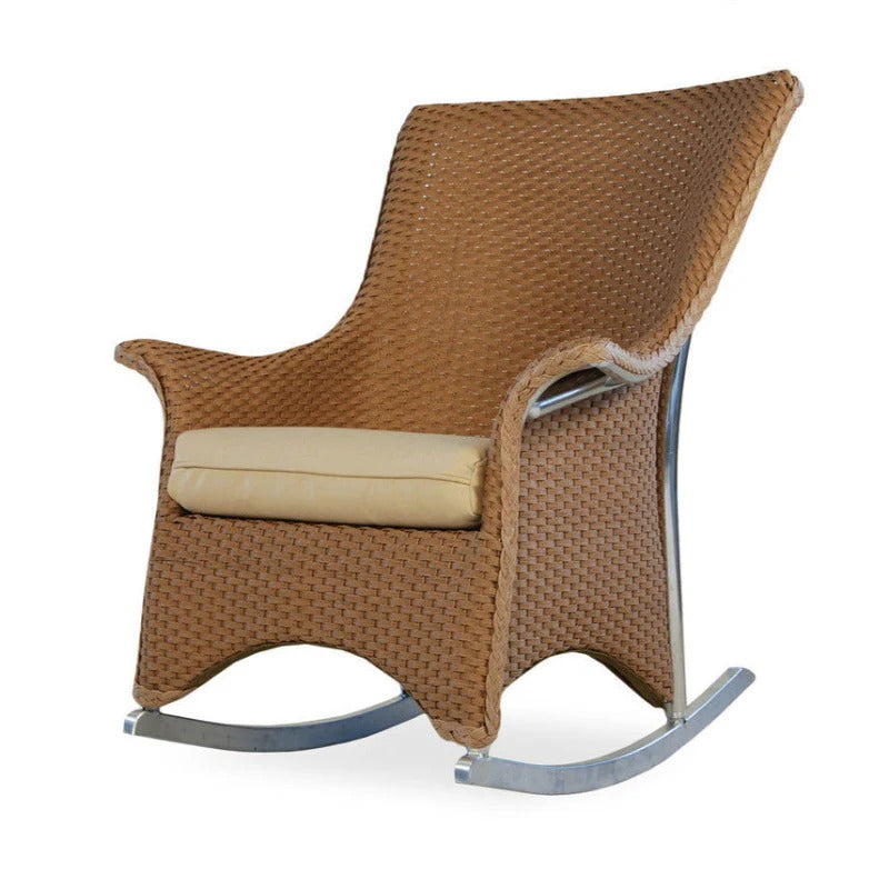 Brown wicker rocking chair with beige cushion on a white background