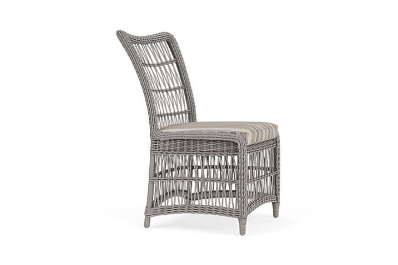 Wicker chair with cushion on a white background