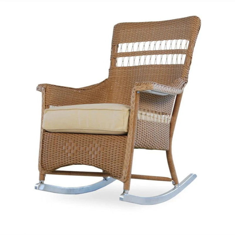 Wicker rocking chair with beige cushion on a white background
