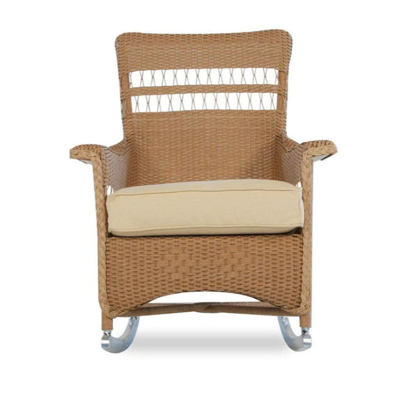Wicker rocking chair with beige cushion on a white background