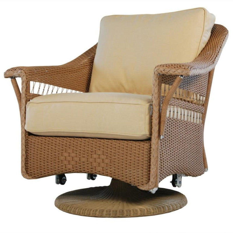Wicker chair with beige cushions on a white background