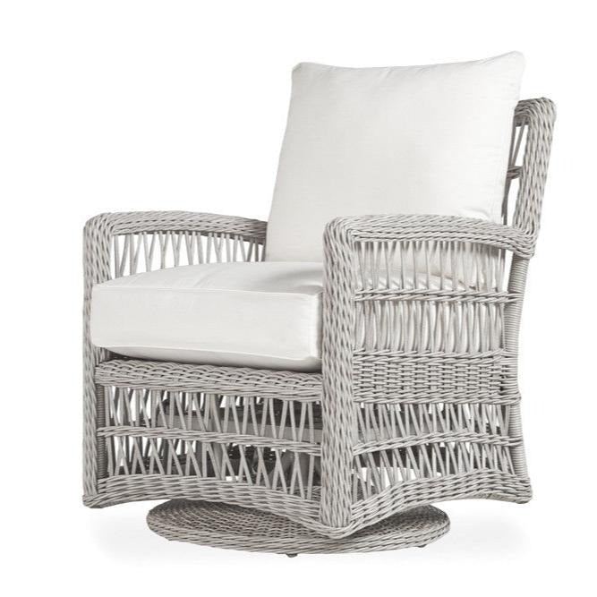 Wicker chair with white cushions on a white background