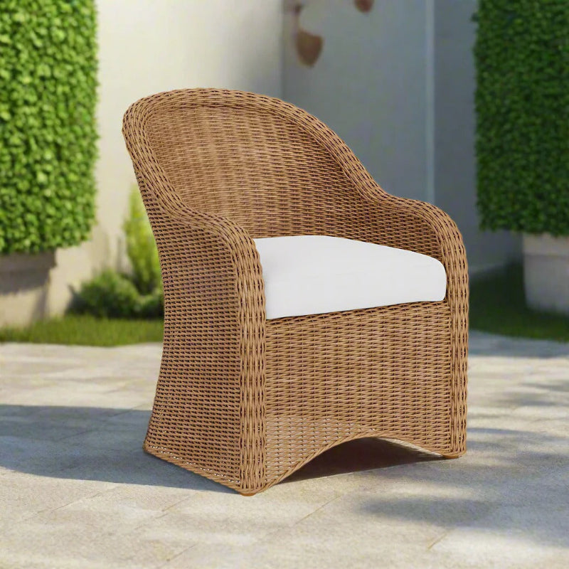 Wicker chair with a white cushion on a patio