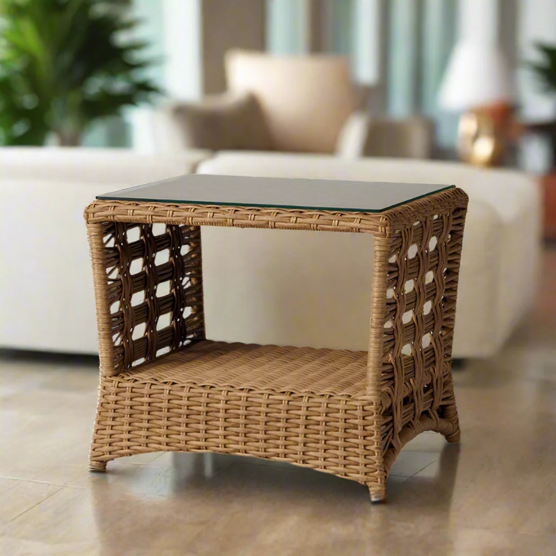 Wicker side table with glass top in a living room setting