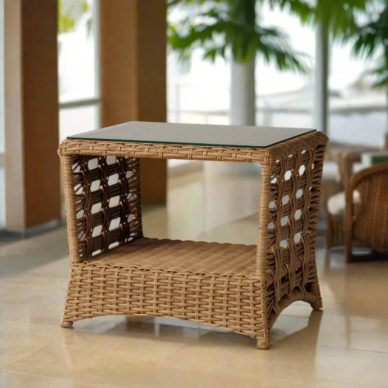 Wicker side table with glass top on a tiled floor
