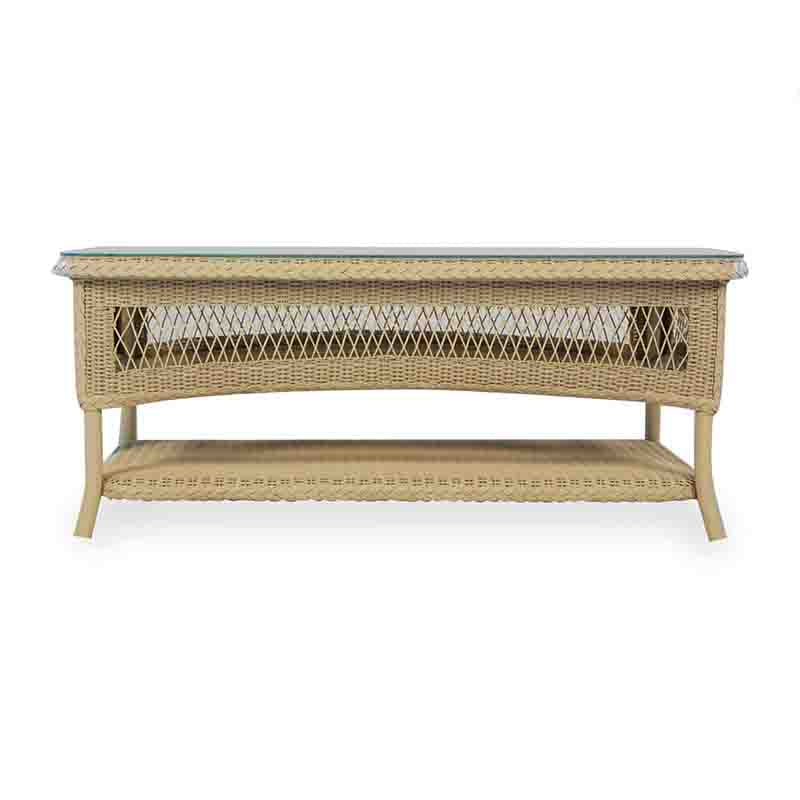 Wicker coffee table with a glass top on a white background