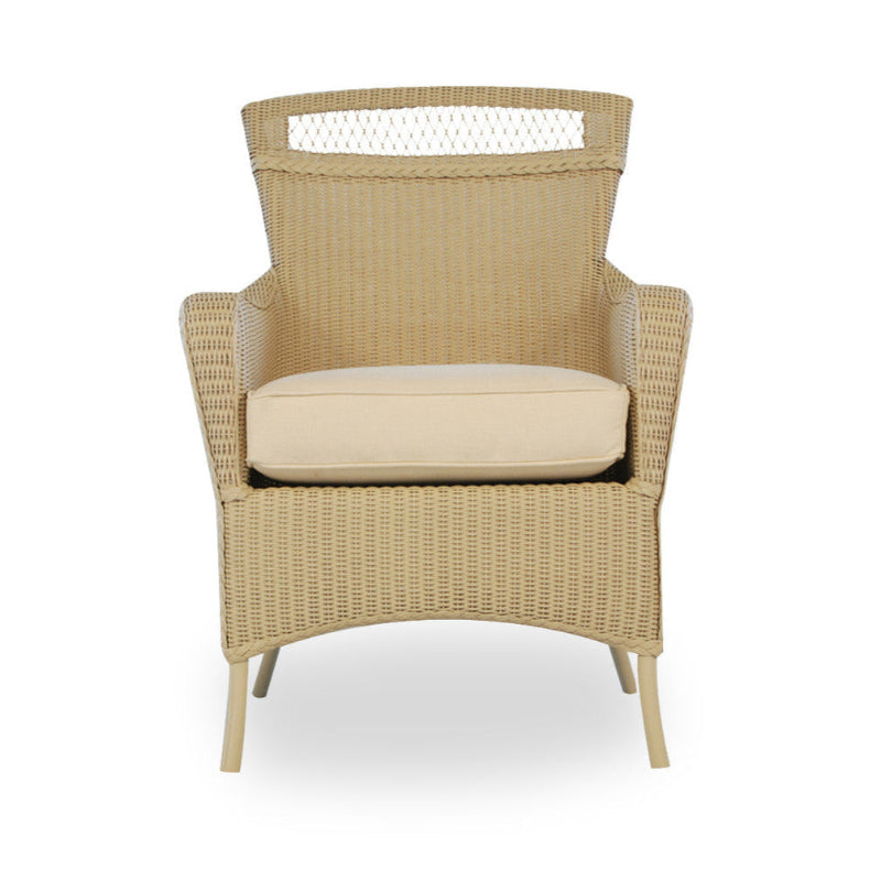 Beige wicker chair with a cushion on a white background