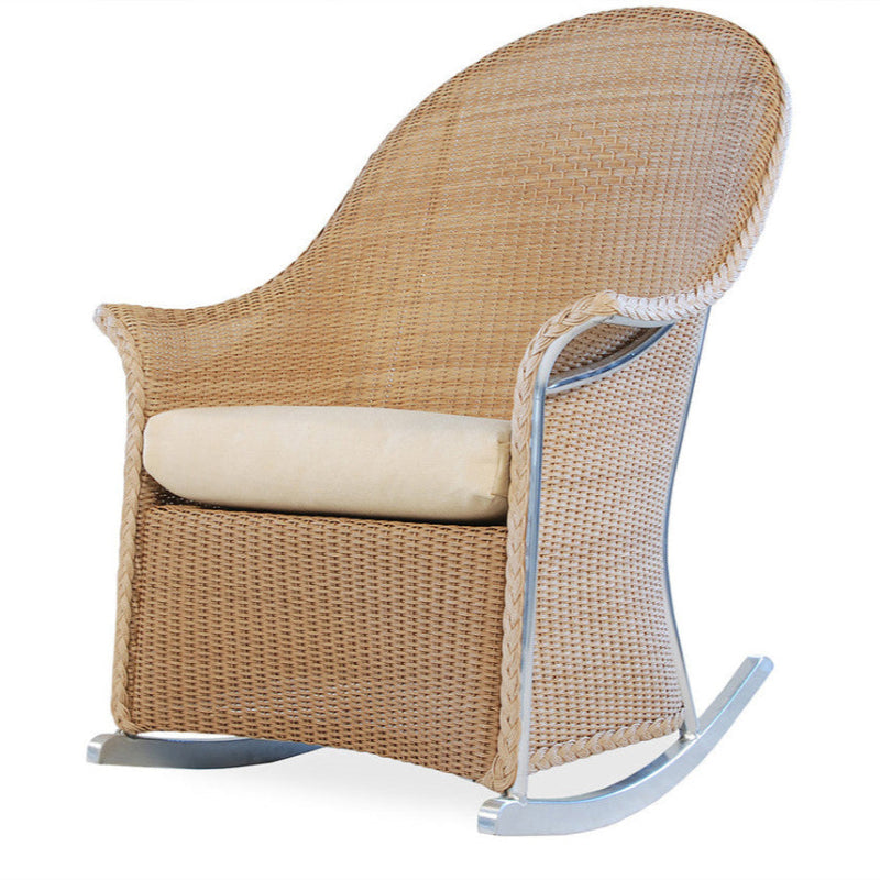 Wicker rocking chair with beige cushion on a white background