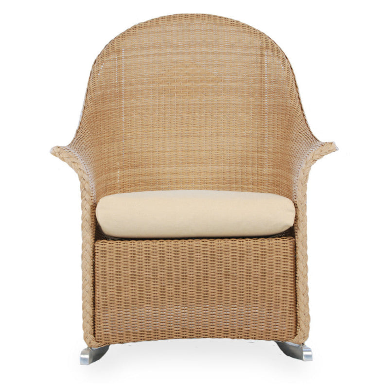 Wicker chair with a beige cushion on a white background